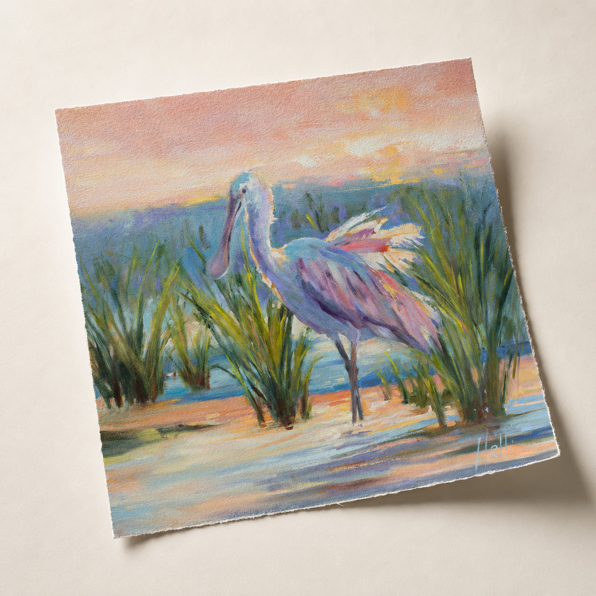 A square art print depicting a pastel-colored rose-breasted spoonbill standing in marsh grass, shown at an angle on a light beige background.